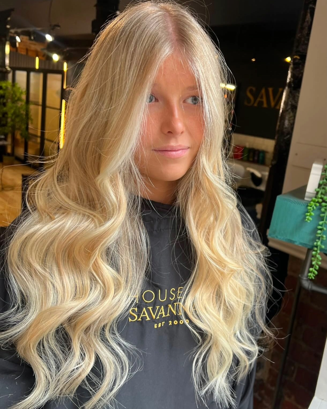 Long, thick, natural looking human hair extensions fitted by the expert stylists at house of savannah hair salon in newcastle beautiful, long flowing blonde hair styled in soft waves created by the stylists at house of savannah hair salon, newcastle city centre